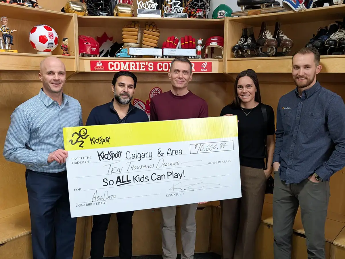 AbaData Charity Cheque Delivery KidSport Calgary and Area with AbaData executives handing over a $10,000 cheque to KidSport Calgary and Area CEO